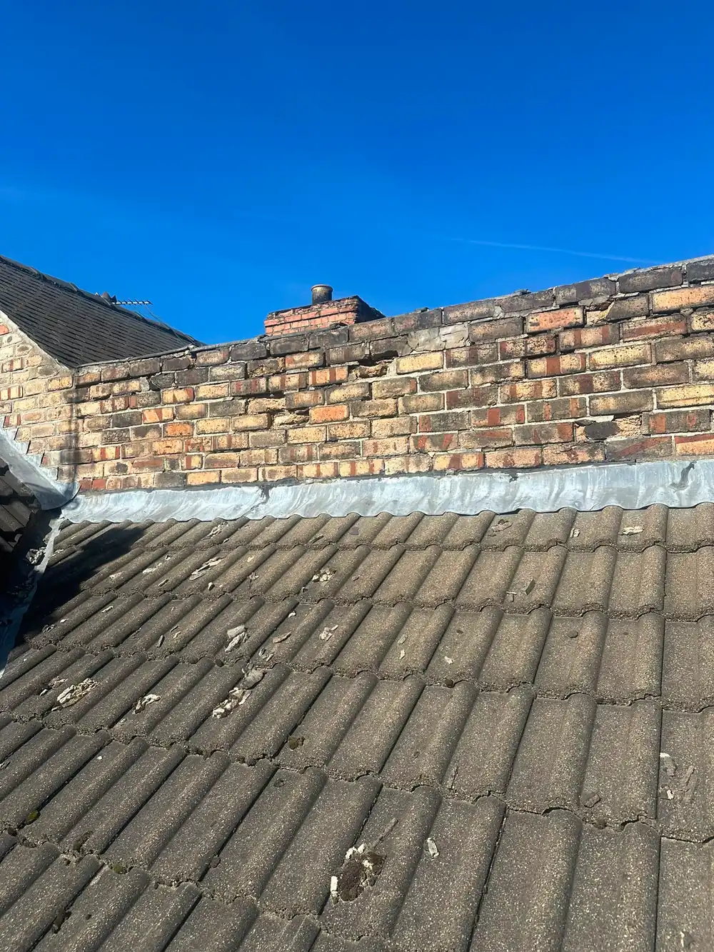 A chimney stack with new lead flashing.