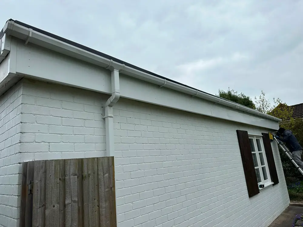 A new white fascia, soffit and gutter run.