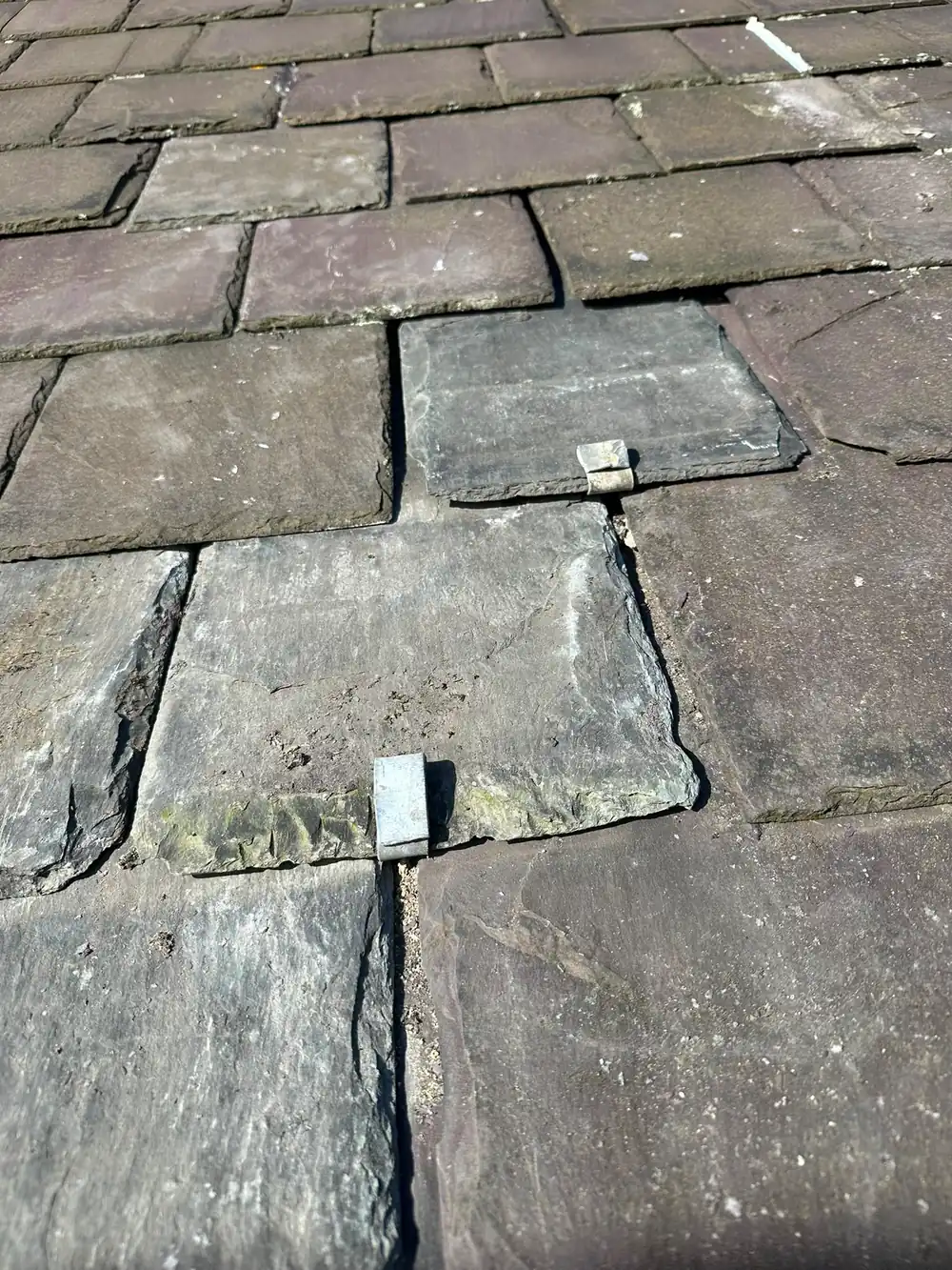 Slates refixed with new lead tingles.