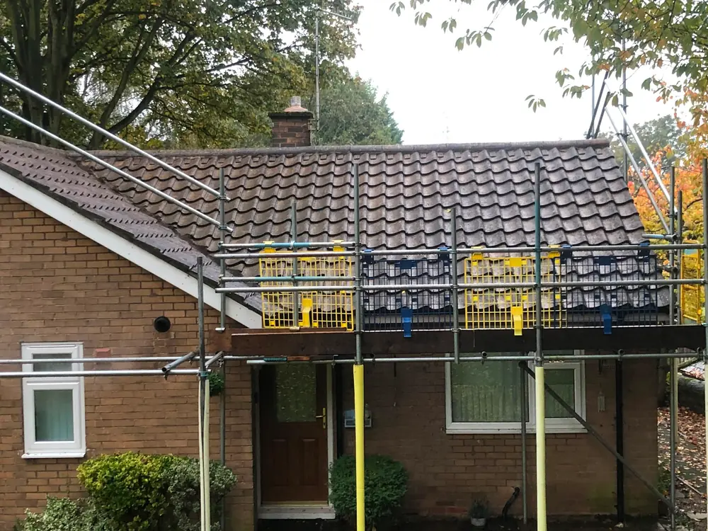 A bungalow roof after moss removal.